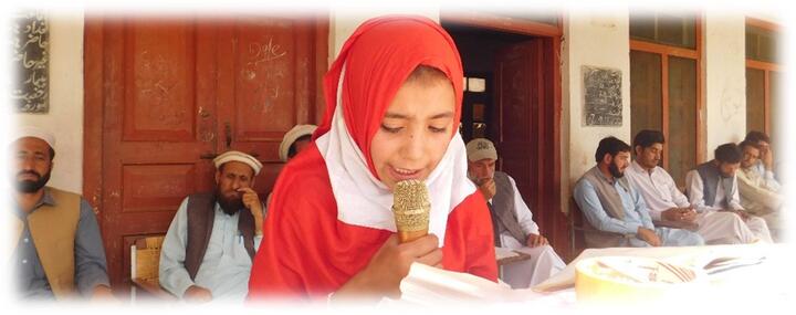 A student of Grade-2 from MLE School Ashoran is devlivering her speech A student of Grade-2 from MLE School Ashoran is devlivering her speech